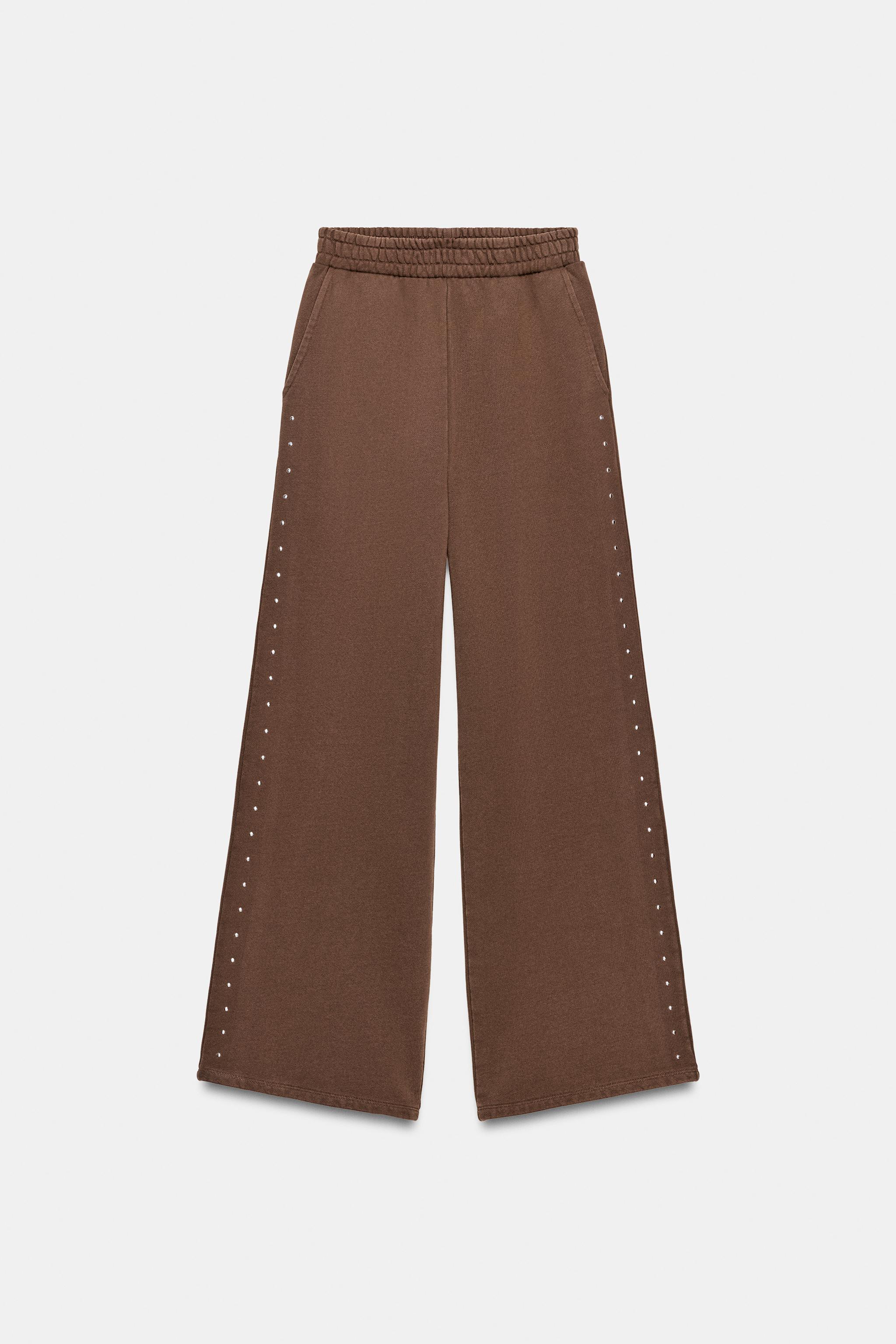 WASHED EFFECT FLEECE PANTS WITH STUDS